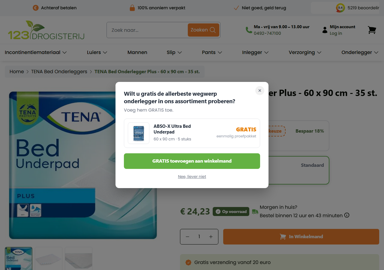 The free-sample popup on the TENA Bed Underpad product page: a centered white card offering a free ABSO-X Ultra Bed Underpad sample with a green GRATIS toevoegen aan winkelmand button.